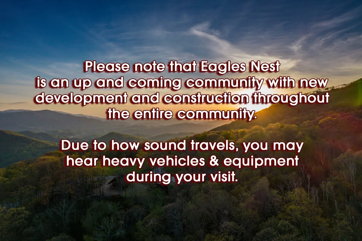 A breathtaking view of a mountain range at sunset, with forest greenery in the foreground and a vibrant sky. The scene suggests tranquility, awe, and the natural beauty available to guests at White Eagle Lodge and nearby Eagles Nest amenities.